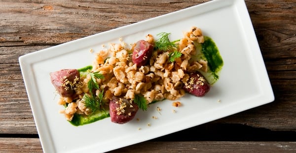 corned gizzards with spaetzle on a plate