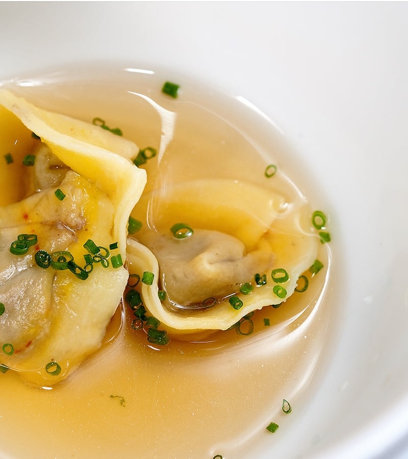 duck liver ravioli in a light broth