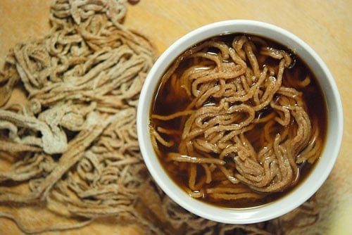 A bowl of venison stock with noodles