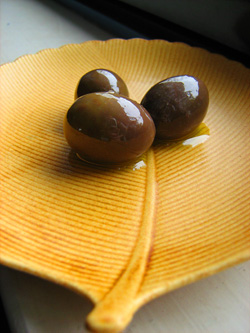 Three oil-cured Cretan olives