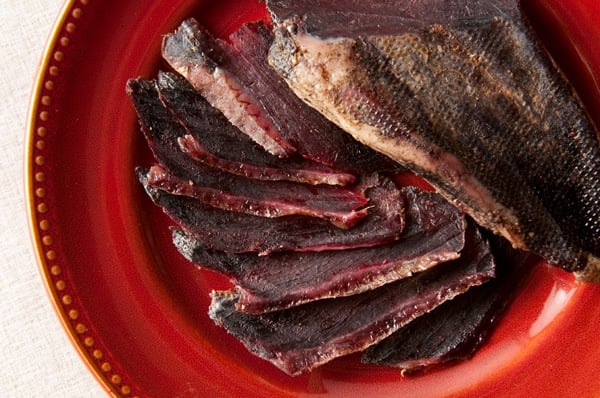 Slices of duck prosciutto on a plate