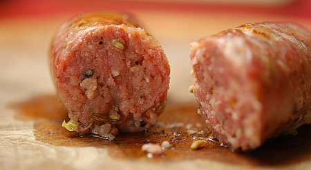 A close up of a piece of food, with Sausage and Pork