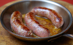 A bowl of food, with Sausage and Bratwurst