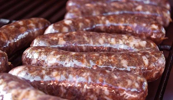 Venison sausage with garlic on the grill