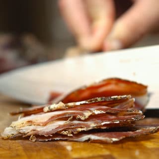 A close up of venison ham slices