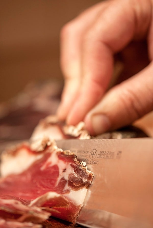 slicing venison ham