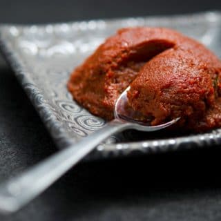 Homemade tomato paste on a plate.
