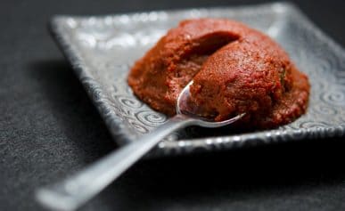 Homemade tomato paste on a plate.