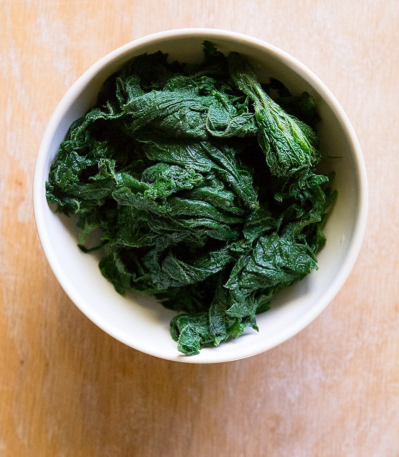 Blanched stinging nettles in a bowl