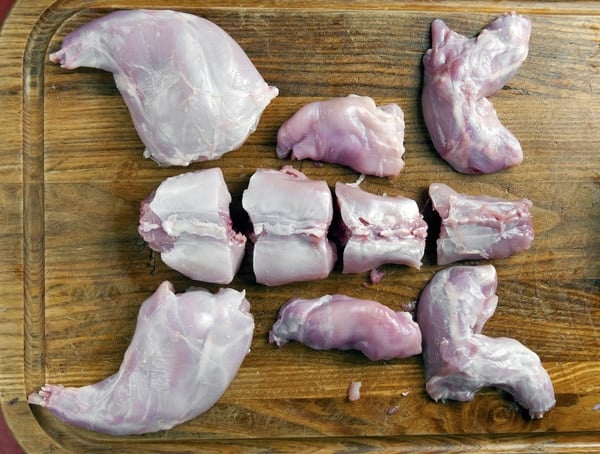 A rabbit cut into serving pieces. 