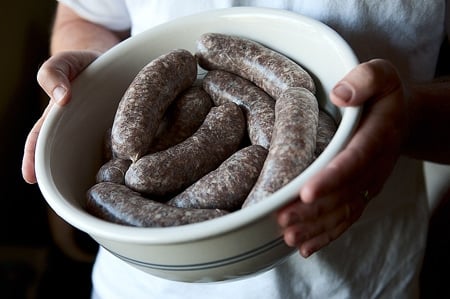 A bowl of venison sausages