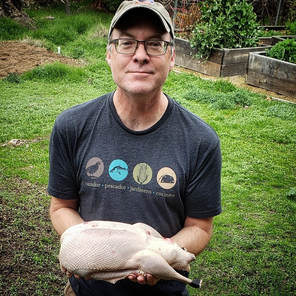 Hank Shaw holding a plucked Canada goose