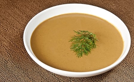 A bowl of soup, with Acorn and Sour Cream
