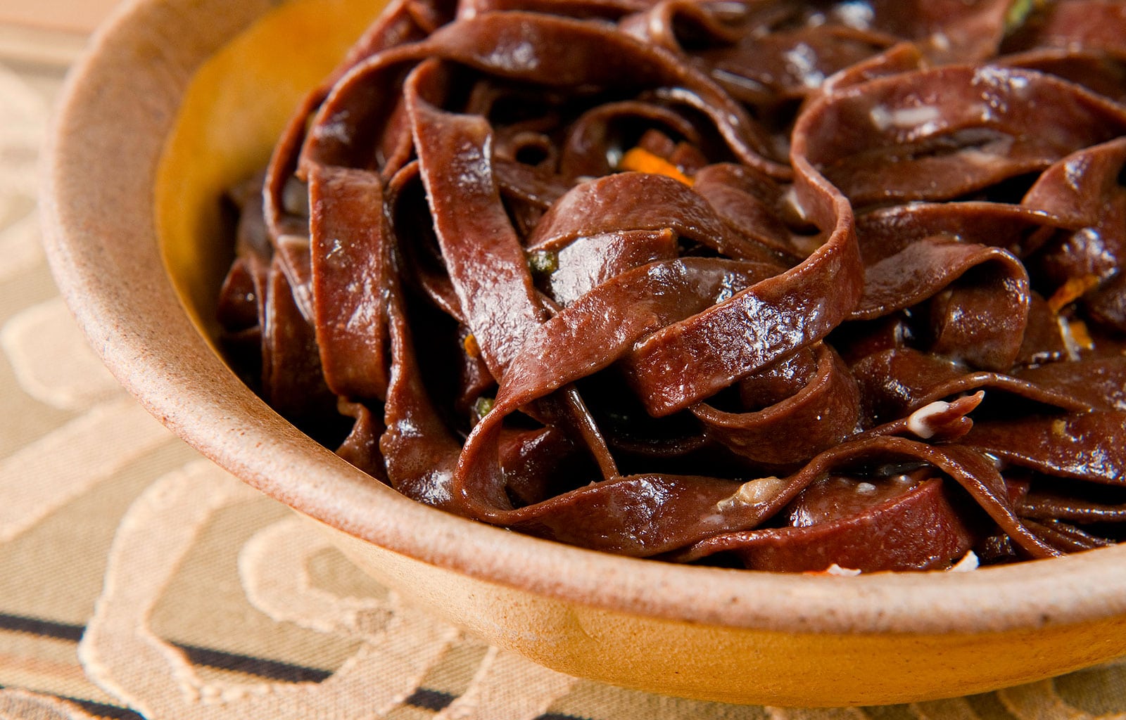 Close up of a bowl of blood pasta. 