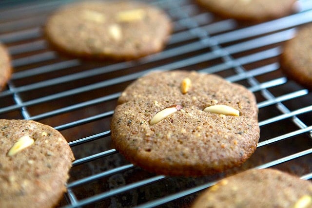 pine nut cookies on a cooling rack
