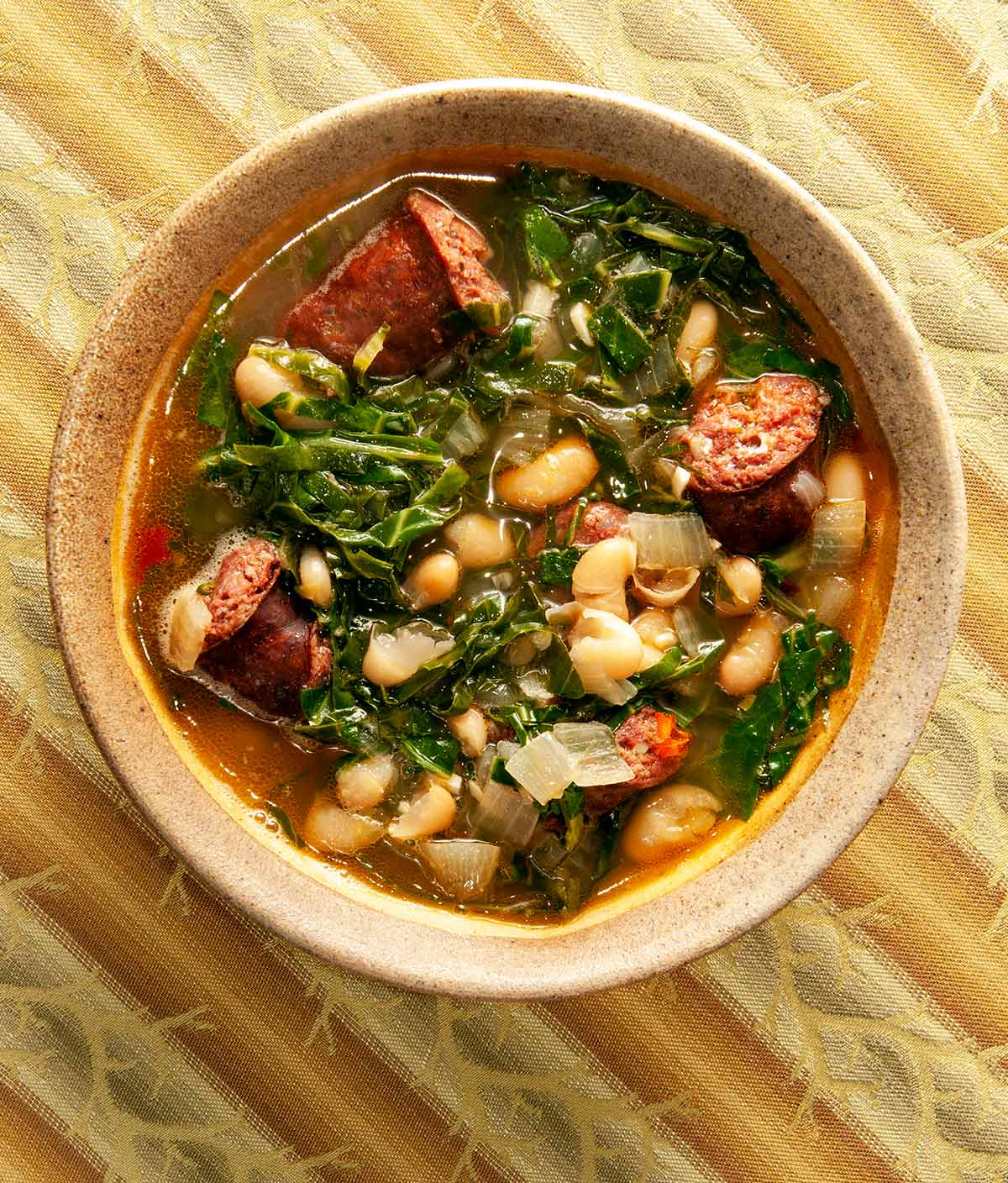 A bowl of caldo verde, kale soup with linguica. 