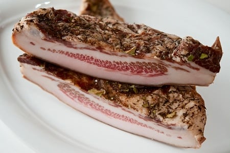 Slices of guanciale on a plate. 