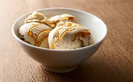 pine nut ice cream with honey drizzled over the top
