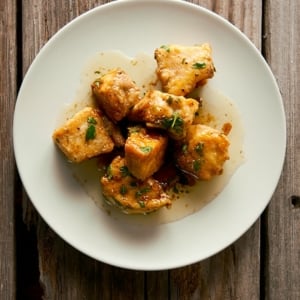 fish with honey and ouzo on a plate