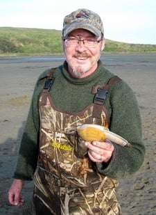Hank Shaw holding a gaper clam