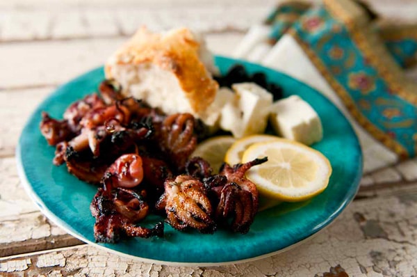 Grilled octopus with bread. 