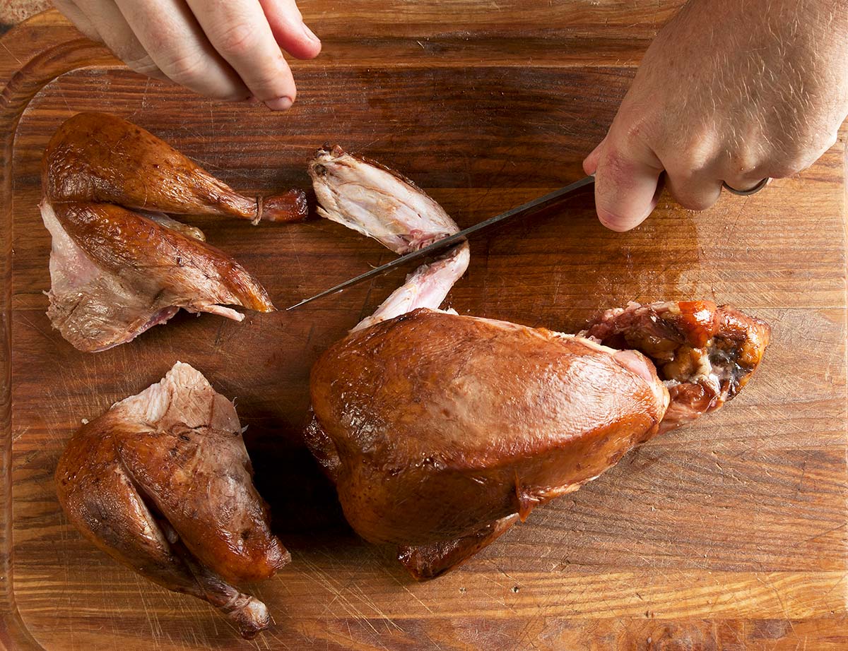 Carving a smoked pheasant