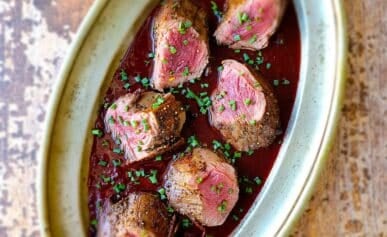 A platter of venison with Cumberland sauce.