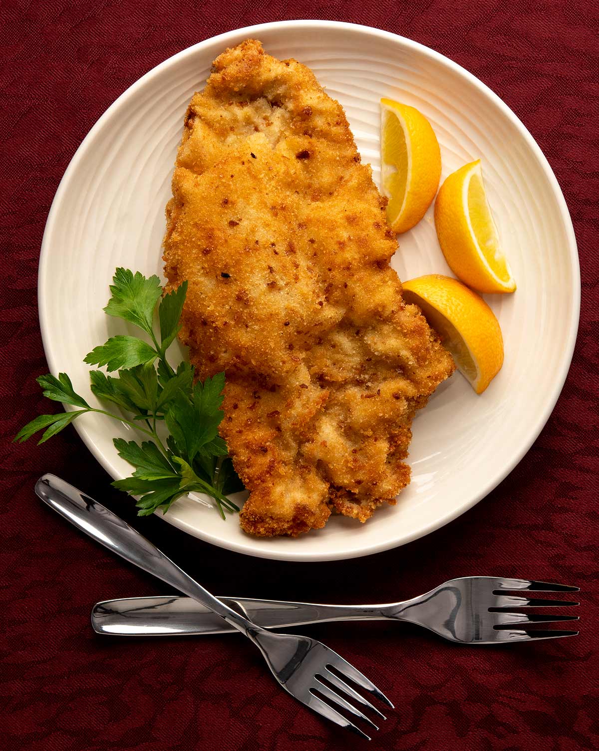 A plate of wiener schnitzel.