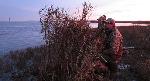 Waiting for ducks behind a makeshift blind. 