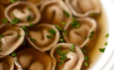 Closeup of a bowl of cappelletti pasta en brodo