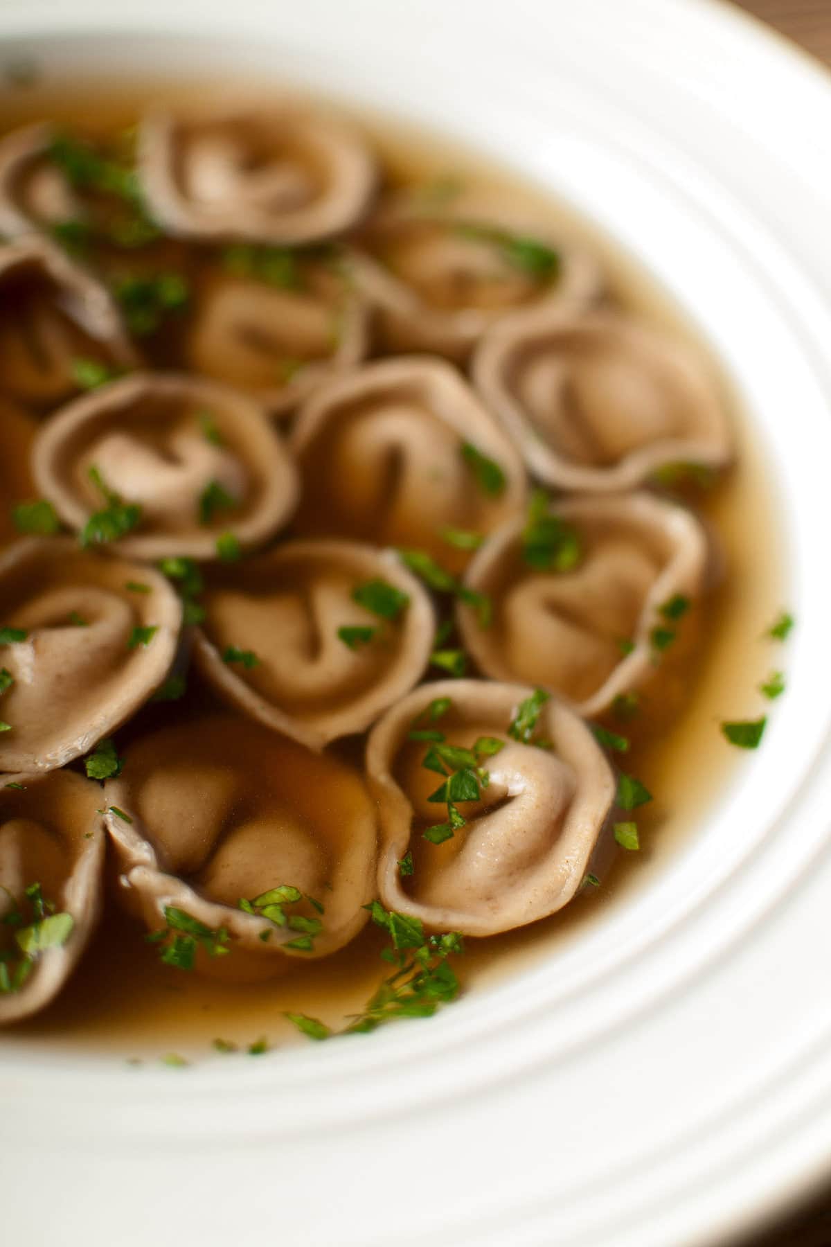 Closeup of a bowl of cappelletti pasta en brodo