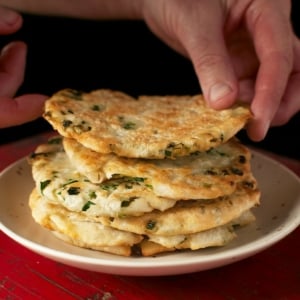 Stacking a pile of scallion pancakes