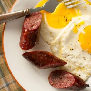 A plate of Polska kielbasa with eggs.