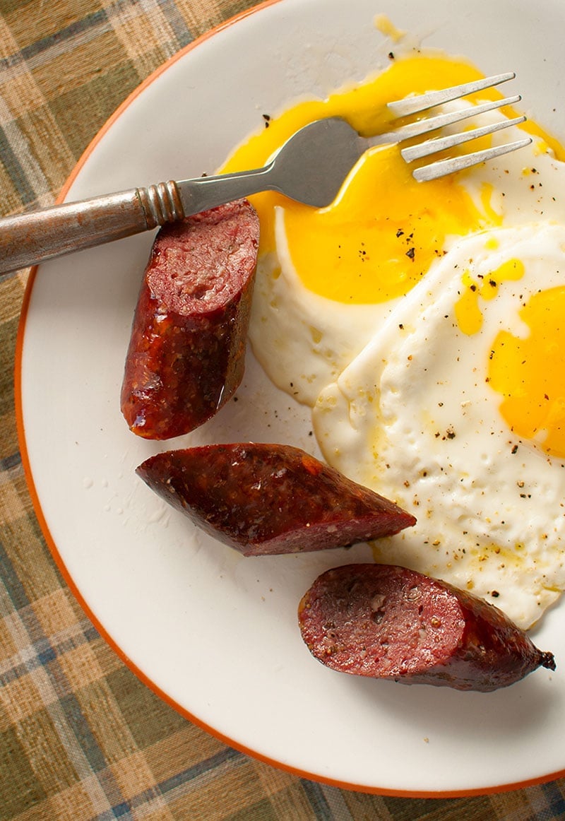 A plate of Polska kielbasa with eggs. 