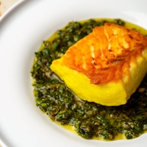 Italian salsa verde with halibut on a plate