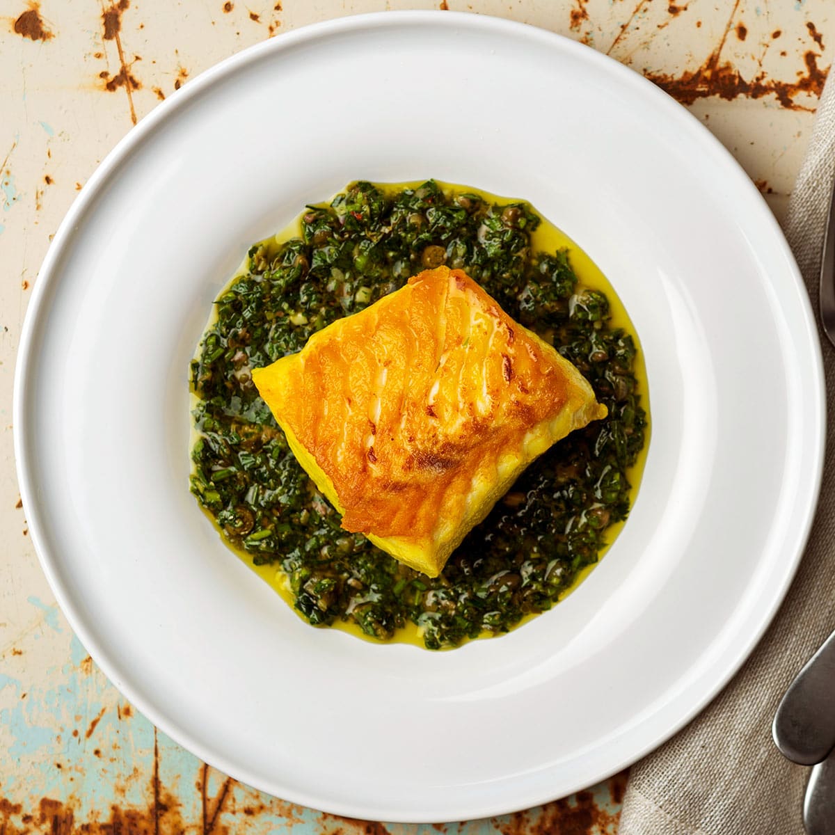 Italian salsa verde served with saffron brined halibut