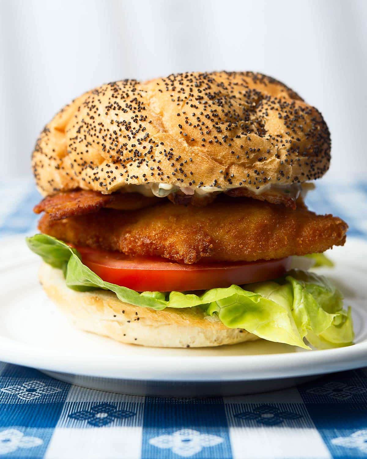 A fried fish sandwich on a plate