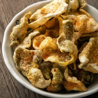 Close up of a bowl of fish skin chips.