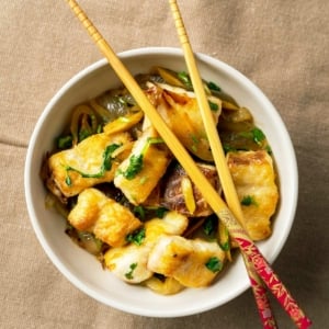 Crispy Vietnamese fish in a bowl with chopsticks.