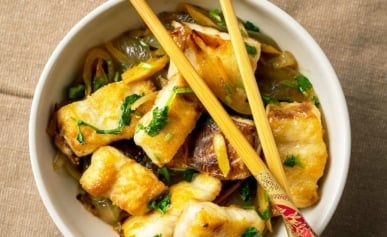 Crispy Vietnamese fish in a bowl with chopsticks.