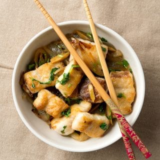 A bowl of Vietnamese crispy fish with cilantro.