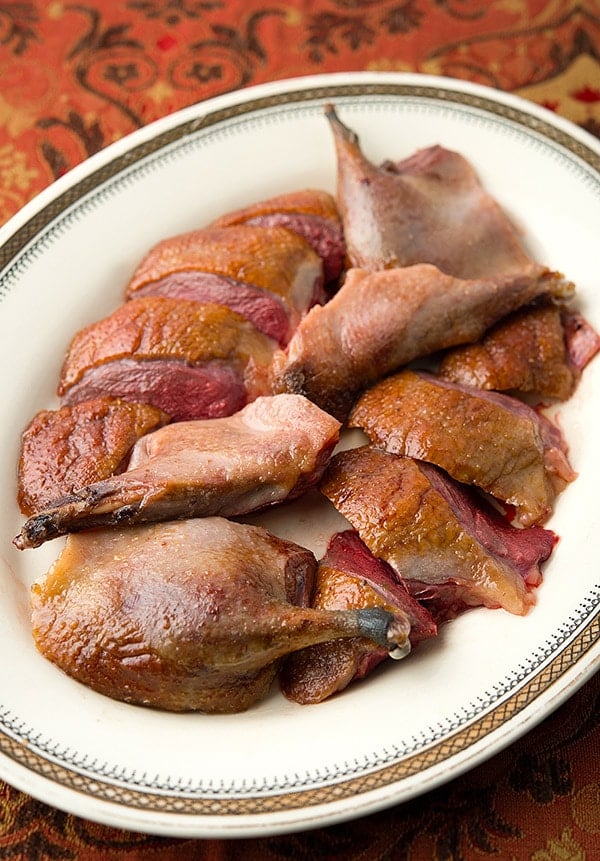 roast wild duck sliced on a platter