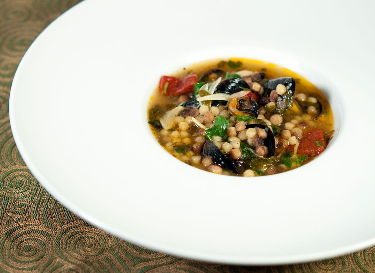 A bowl of Sardinian soup with mussels and clams