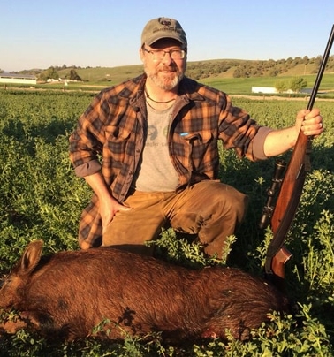 Hank Shaw with a wild boar.
