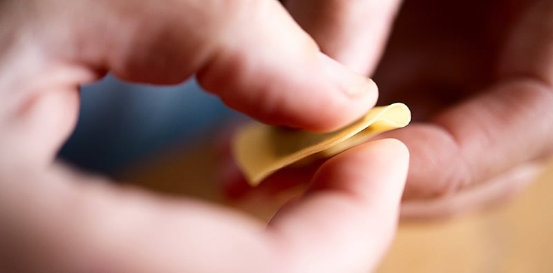 Hank Shaw folding a mushroom tortellino