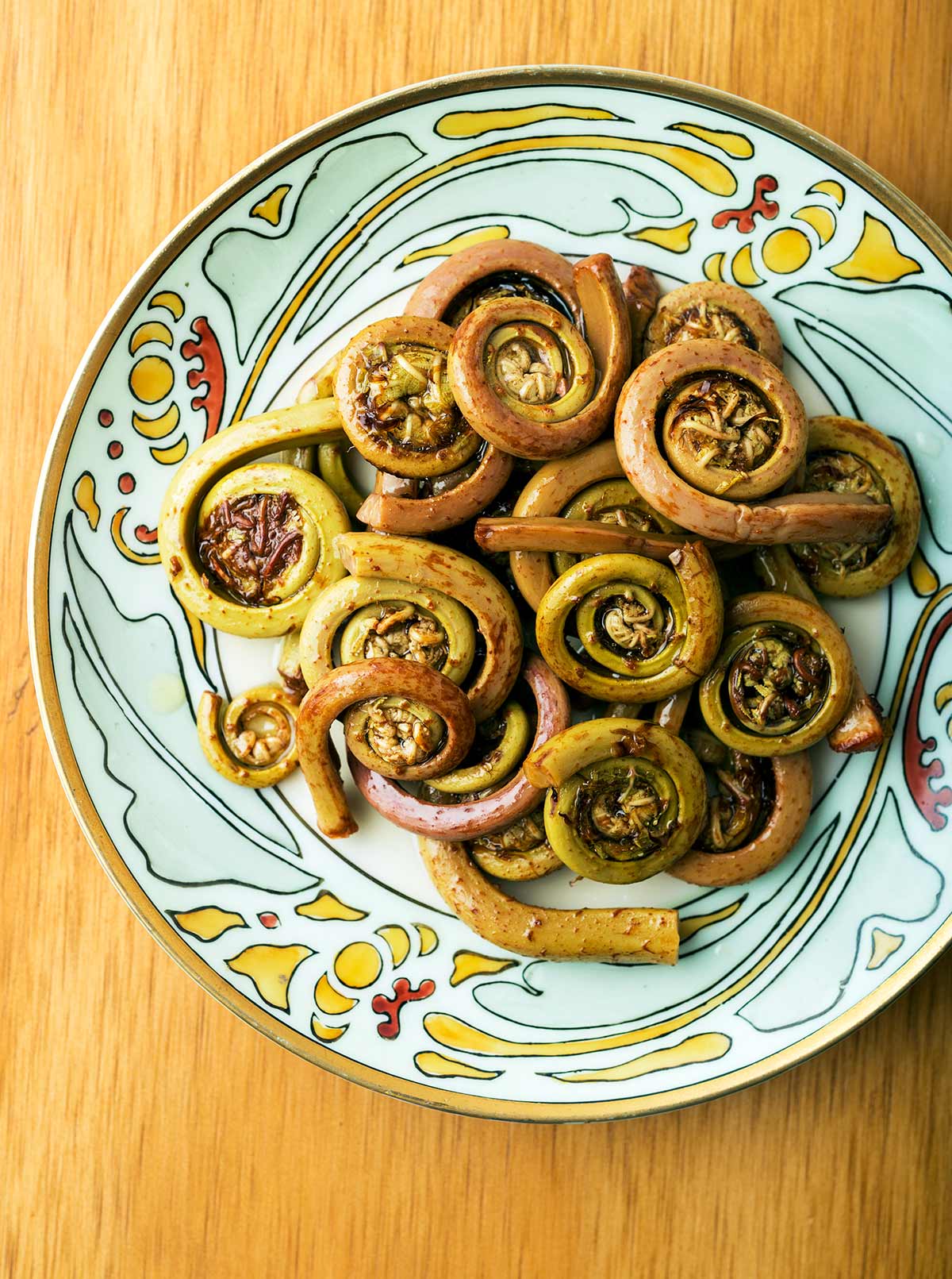 Pickled fiddleheads on a plate