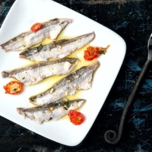 A plate of boquerones ready to eat.