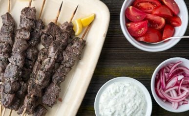 A platter of venison souvlaki with all the fixins.