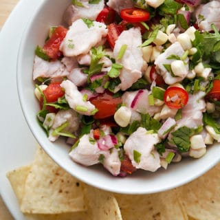 Basic ceviche recipe in a bowl with tortillas.