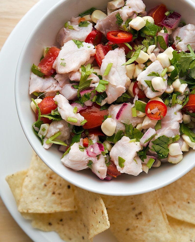 Basic ceviche recipe in a bowl with tortillas.